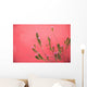 A Pink Flowering Plant Growing Beside A Red Wall Wall Mural