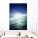 Closeup angle of green wave with backlit crest, bright blue sky Wall Mural