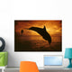 A Pair Of Atlantic Bottlenose Dolphin Leap Into A Caribbean Sunset Wall Mural