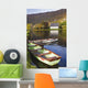 St Finbarre's Oratory And Rowing Boats On Shore Of Gougane Barra Lake Wall Mural