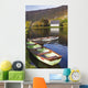 St Finbarre's Oratory And Rowing Boats On Shore Of Gougane Barra Lake Wall Mural