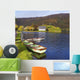 St Finbarre's Oratory And Rowing Boats On Shore Of Gougane Barra Lake Wall Mural
