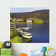 St Finbarre's Oratory And Rowing Boats On Shore Of Gougane Barra Lake Wall Mural