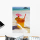 Mai Tai Getting Splashed By A Wave As It Rest On The Beach Wall Mural