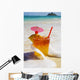 Mai Tai Getting Splashed By A Wave As It Rest On The Beach Wall Mural