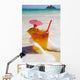 Mai Tai Getting Splashed By A Wave As It Rest On The Beach Wall Mural