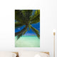 Palm tree over Pacific ocean with Mokulua island in background Wall Mural