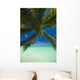 Palm tree over Pacific ocean with Mokulua island in background Wall Mural
