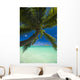 Palm tree over Pacific ocean with Mokulua island in background Wall Mural