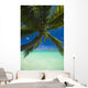 Palm tree over Pacific ocean with Mokulua island in background Wall Mural