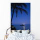 Palm tree over Pacific ocean with Mokulua island in background Wall Mural
