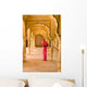 Woman In Bright Pink Sari Stands Beneath Arches Wall Mural