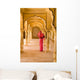 Woman In Bright Pink Sari Stands Beneath Arches Wall Mural