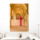 Woman In Bright Pink Sari Stands Beneath Arches Wall Mural