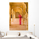 Woman In Bright Pink Sari Stands Beneath Arches Wall Mural
