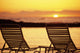 Hawaii, Two Silhouetted Chairs On Beach At Sunset, View From Behind Wall Mural