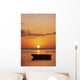 Sun Setting Over Ocean, Boat Silhouetted Against Orange Sky Wall Mural