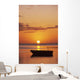 Sun Setting Over Ocean, Boat Silhouetted Against Orange Sky Wall Mural