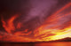 Sunset Over Seascape, Brightly Colored Clouds Illuminated Over Ocean Wall Mural