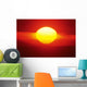 Gorgeous Sun Setting In Bright Orange Sky Over Ocean Wall Mural