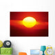 Gorgeous Sun Setting In Bright Orange Sky Over Ocean Wall Mural