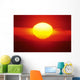 Gorgeous Sun Setting In Bright Orange Sky Over Ocean Wall Mural