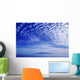 Cotton-Like Clouds In Blue Sky Over Smooth Ocean Water Wall Mural
