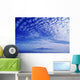 Cotton-Like Clouds In Blue Sky Over Smooth Ocean Water Wall Mural