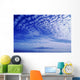 Cotton-Like Clouds In Blue Sky Over Smooth Ocean Water Wall Mural