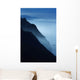 Silhouetted Cliffs Along Foggy Ocean Shoreline Wall Mural