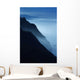 Silhouetted Cliffs Along Foggy Ocean Shoreline Wall Mural