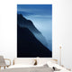 Silhouetted Cliffs Along Foggy Ocean Shoreline Wall Mural
