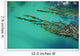 Seaweed floating in turquoise ocean water on coastline Wall Mural