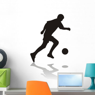 Silhouette Soccer Player shown on a wall