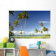 Grassy shoreline with tall palm trees Wall Mural