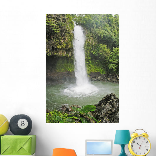 Fiji, Taveuni, Tavoro Waterfall cascading into tropical pool Wall Mural