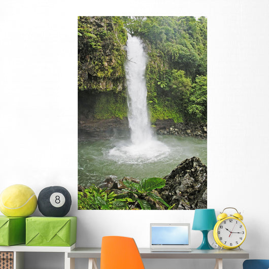 Fiji, Taveuni, Tavoro Waterfall cascading into tropical pool Wall Mural