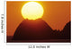 Sun Setting In Orange Sky Over Ocean And Silhouetted Hill Wall Mural