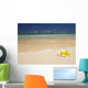 Two Plumerias Resting On The Sand Of A Gorgeous Tropical Beach Wall Mural