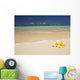 Two Plumerias Resting On The Sand Of A Gorgeous Tropical Beach Wall Mural