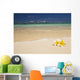 Two Plumerias Resting On The Sand Of A Gorgeous Tropical Beach Wall Mural