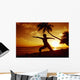 Woman Doing Yoga By The Ocean At Sunset Under Palm Tree Wall Mural