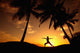Hawaii, Maui, Olowalu, Woman Doing Yoga At Sunset Under Palm Tree Wall Mural