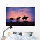 Silhouette Of Donkey Train Statue Against Sunset Wall Mural