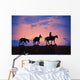 Silhouette Of Donkey Train Statue Against Sunset Wall Mural