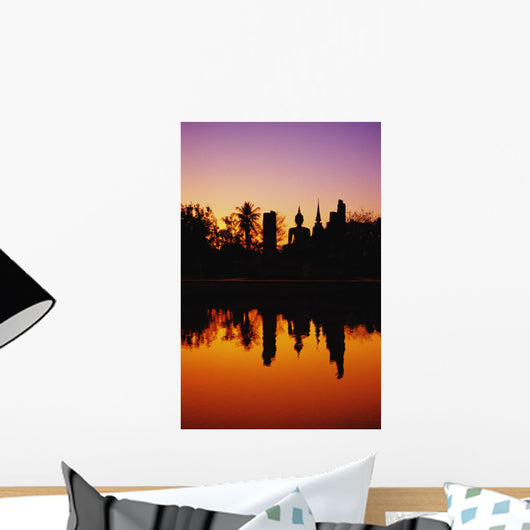 Silhouetted And Reflecting On Water Wall Mural