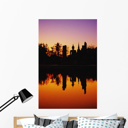 Silhouetted And Reflecting On Water Wall Mural