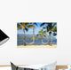 Two hammocks hanging between palm trees on sandy tropical beach Wall Mural