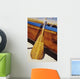 Wooden paddle and outrigger canoe on beach Wall Mural