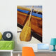 Wooden paddle and outrigger canoe on beach Wall Mural